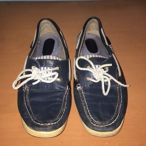 Navy blue Sperry boat shoe.